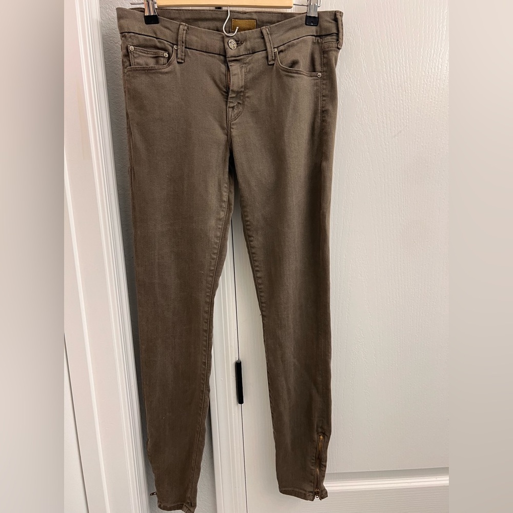 Olive green colored mother skinny low rise denim with zipper at ankle